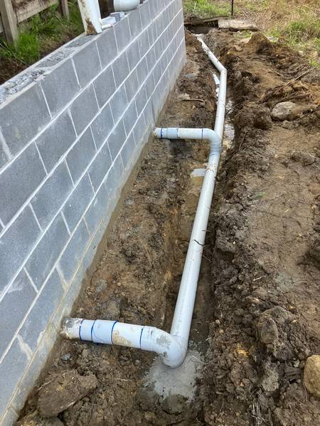 Ag-line behind wall - Allsites Excavations Sydney Ag-line drainage behind a block retaining wall in Sydney