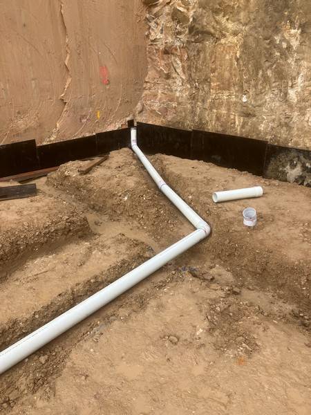 Boundary drainage - Allsites Excavations Sydney Stormwater drainage pipework installed along a Sydney boundary wall