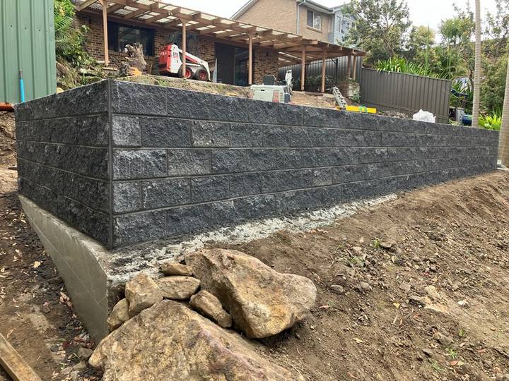 Finished block retaining wall - Allsites Excavations Sydney Completed block retaining wall after excavation and preparation in Sydney