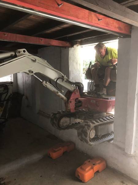 Low-clearance bobcat work - Allsites Excavations Sydney Bobcat working under a low structure during tight access excavation in Sydney