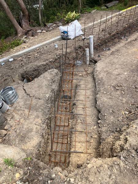 Reinforced footing trench - Allsites Excavations Sydney Steel reinforcement in a retaining wall footing trench in Sydney