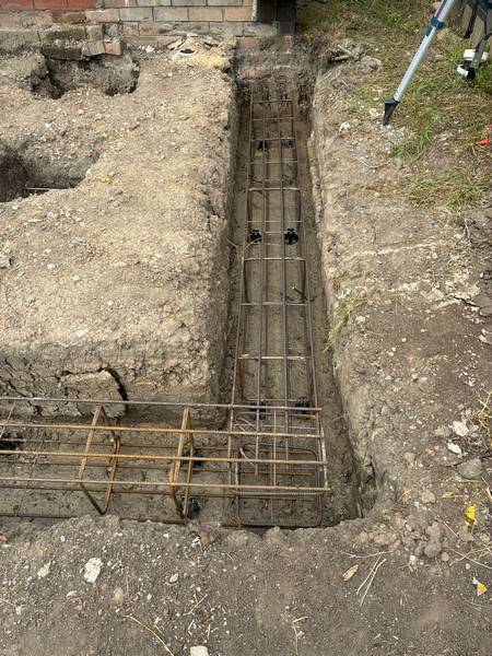 Steel footing cage - Allsites Excavations Sydney Steel footing cage installed in a retaining wall trench in Sydney