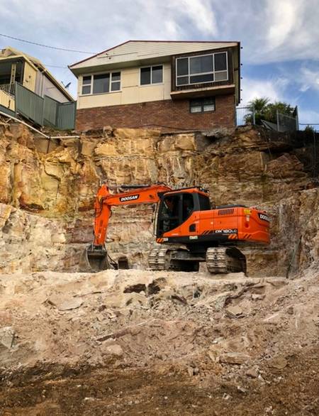 Sandstone excavation - Allsites Excavations Sydney Stepped sandstone excavation below a Sydney residential property