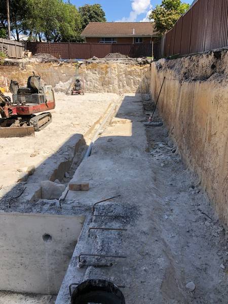 Residential rock cut - Allsites Excavations Sydney Residential rock excavation and footing preparation for a Sydney retaining wall project