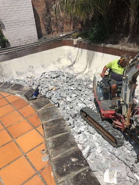 Pool and concrete removal - Allsites Excavations Sydney Tight access pool and concrete excavation with a mini excavator in Sydney