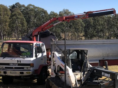 Single axle tip truck with crane hire Sydney Single axle tip truck with crane for excavation material handling and plant transport in Sydney